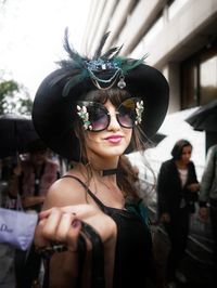 Portrait of young woman wearing sunglasses