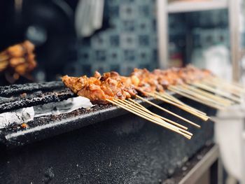 Close-up of meat on barbecue grill