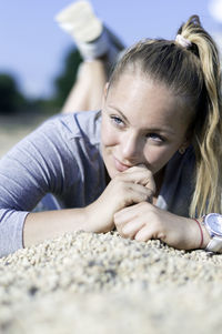 Close-up portrait of smiling young woman