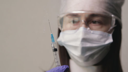 Doctor preparing to inject the vaccine