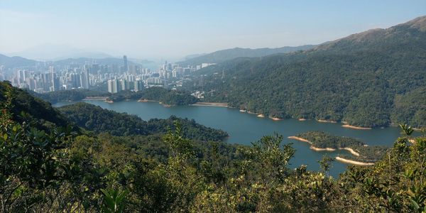 High angle view of river and cityscape against sky