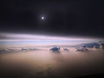 Scenic view of sea against sky at night