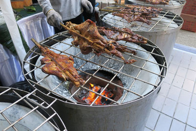 High angle view of meat on barbecue grill