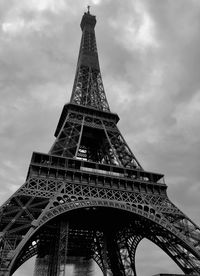 Low angle view of tower against cloudy sky