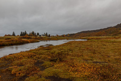 View of lake against cloudy sky