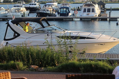 Boats moored at harbor