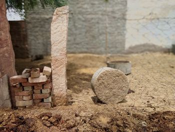 Close-up of stone stack on field