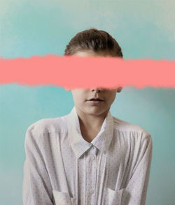 Portrait of young woman standing against sky