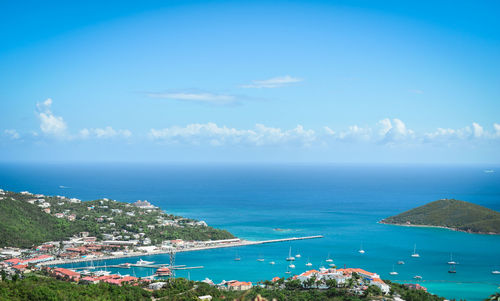 High angle view of sea against blue sky