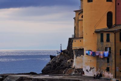 View of sea with buildings in background