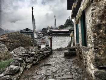 Exterior of old building by mountain against sky