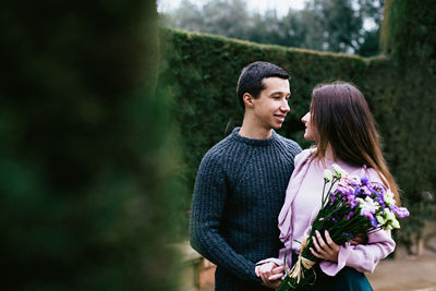 Portrait of happy young couple in garden