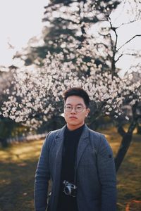 Portrait of young man standing outdoors