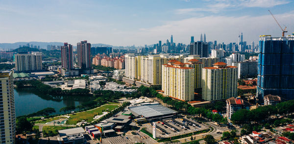 High angle view of buildings in city against sky