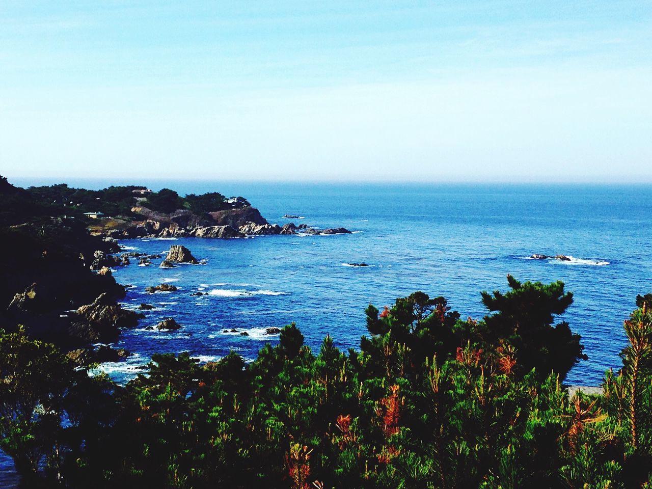 sea, water, horizon over water, clear sky, beauty in nature, tranquil scene, scenics, tranquility, copy space, blue, nature, idyllic, seascape, sky, high angle view, plant, coastline, tree, growth, outdoors