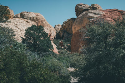 Low angle view of rock formation against clear sky