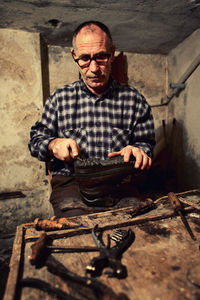 Portrait of man wearing eyeglasses