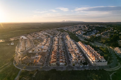 Aerial view of townscape during sunset
