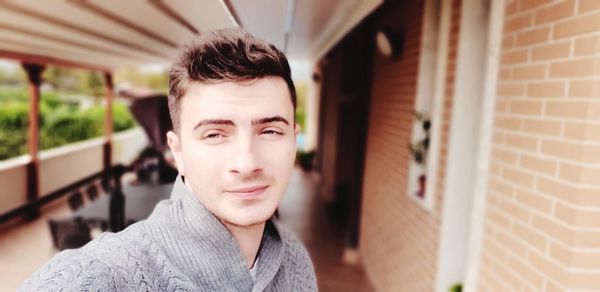 Portrait of young man standing outdoors