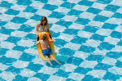 High angle view of woman walking in swimming pool