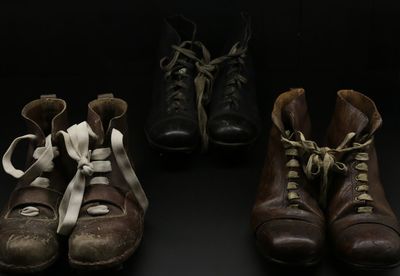 Close-up of shoes against black background