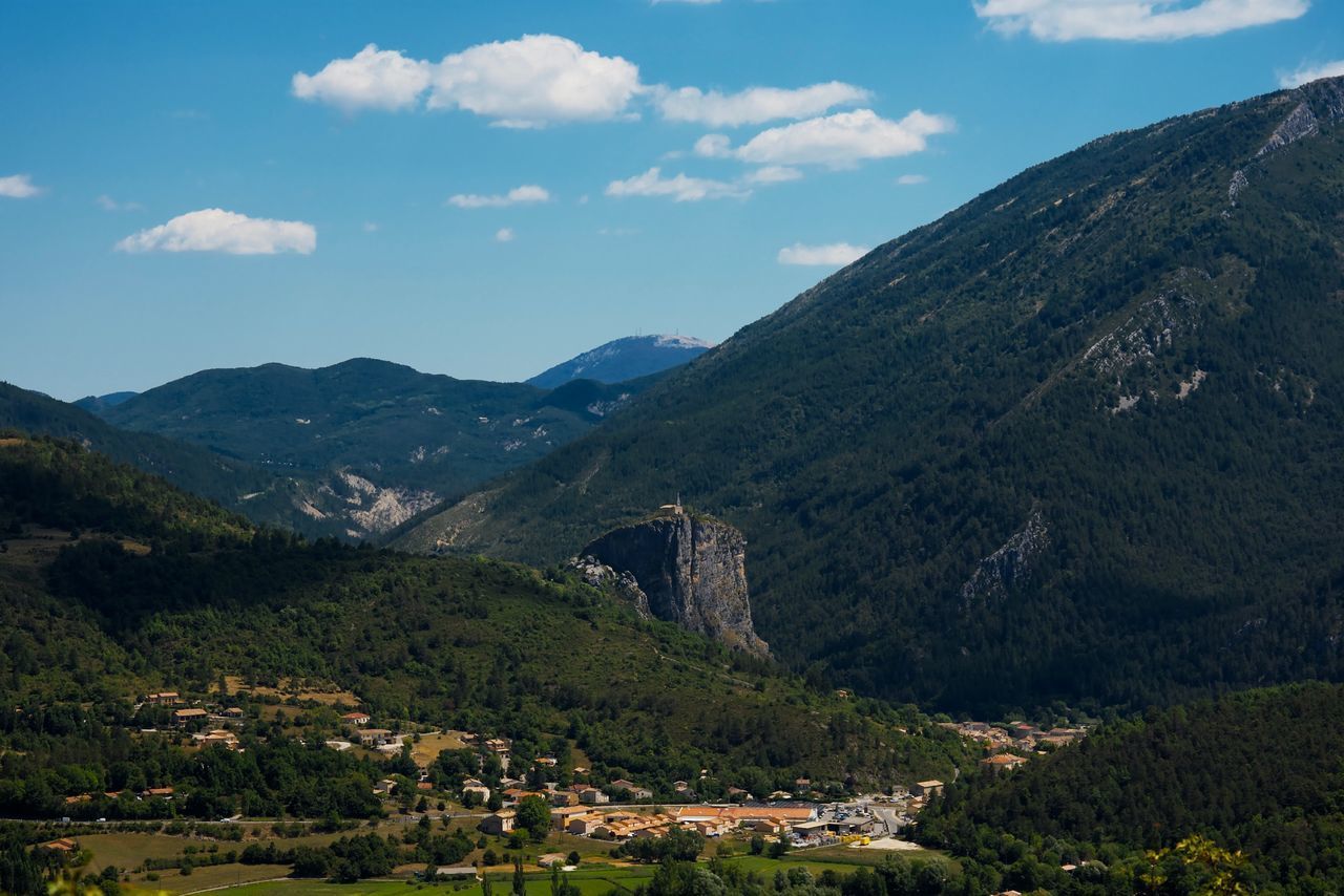 SCENIC VIEW OF MOUNTAIN AND TREES AGAINST SKY