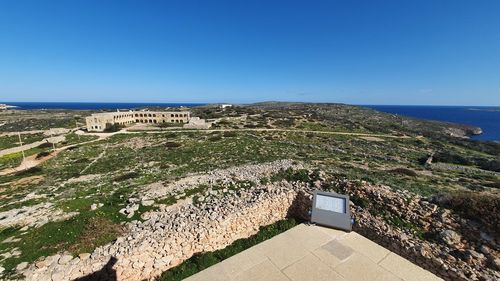 Scenic view of sea against clear blue sky