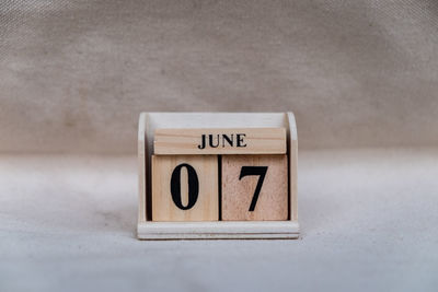 Close-up of information sign on table