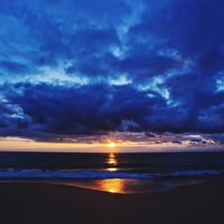 Scenic view of sea against dramatic sky