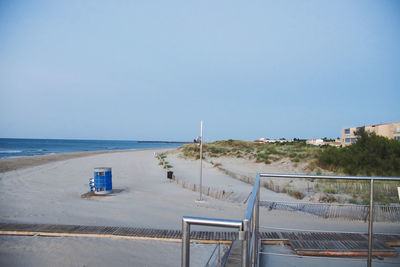 Scenic view of beach against clear sky