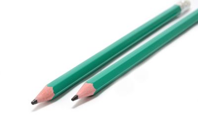 Close-up of colored pencils against white background