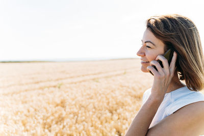 Summer concept, caucasian middle-aged woman in the countryside