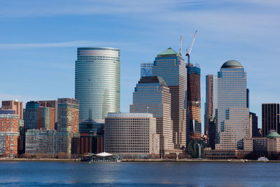 Modern buildings in city against sky