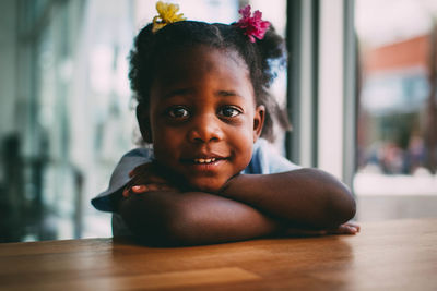 Close-up portrait of boy sitting at home