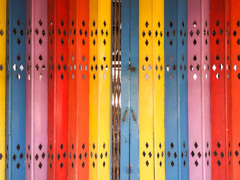 Full frame shot of multi colored metal gate