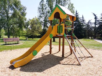 View of playground in park during sunny day