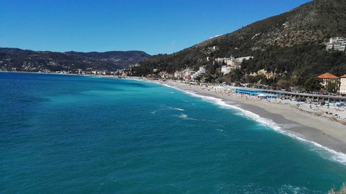 Scenic view of sea against clear blue sky