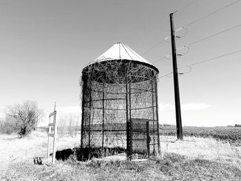 Built structure on field against clear sky