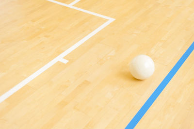 Close-up of on volleyball on court