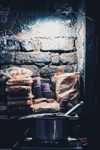 Close-up of old wine bottles on wall