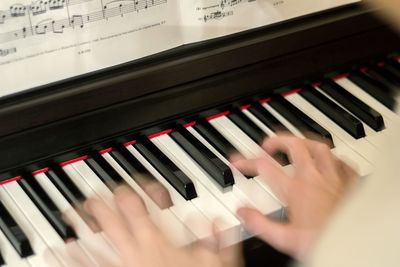 Blurred hands playing the piano