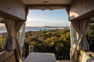Scenic view of sea seen through window