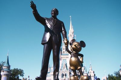 Low angle view of statue against building