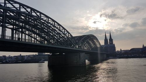 Bridge over river with city in background