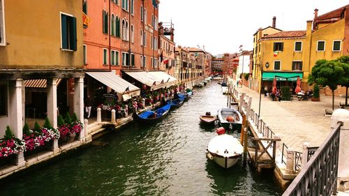 High angle view of canal along buildings