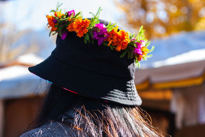 Rear view of woman with multi colored umbrella