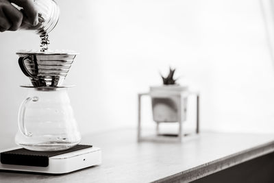Close-up of electric lamp on table at home