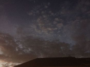 Low angle view of building against sky at dusk