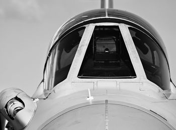 Monochrome detail of cockpit canopy on jet fighter aircraft