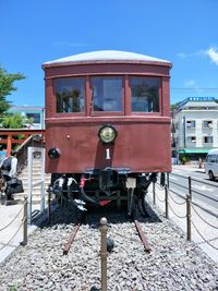 Train on railroad track against sky